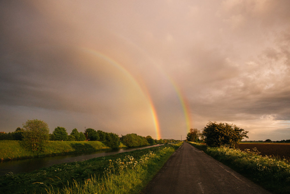 double rainbow over a road and river photographed by Wedding Photographer Lincolnshire