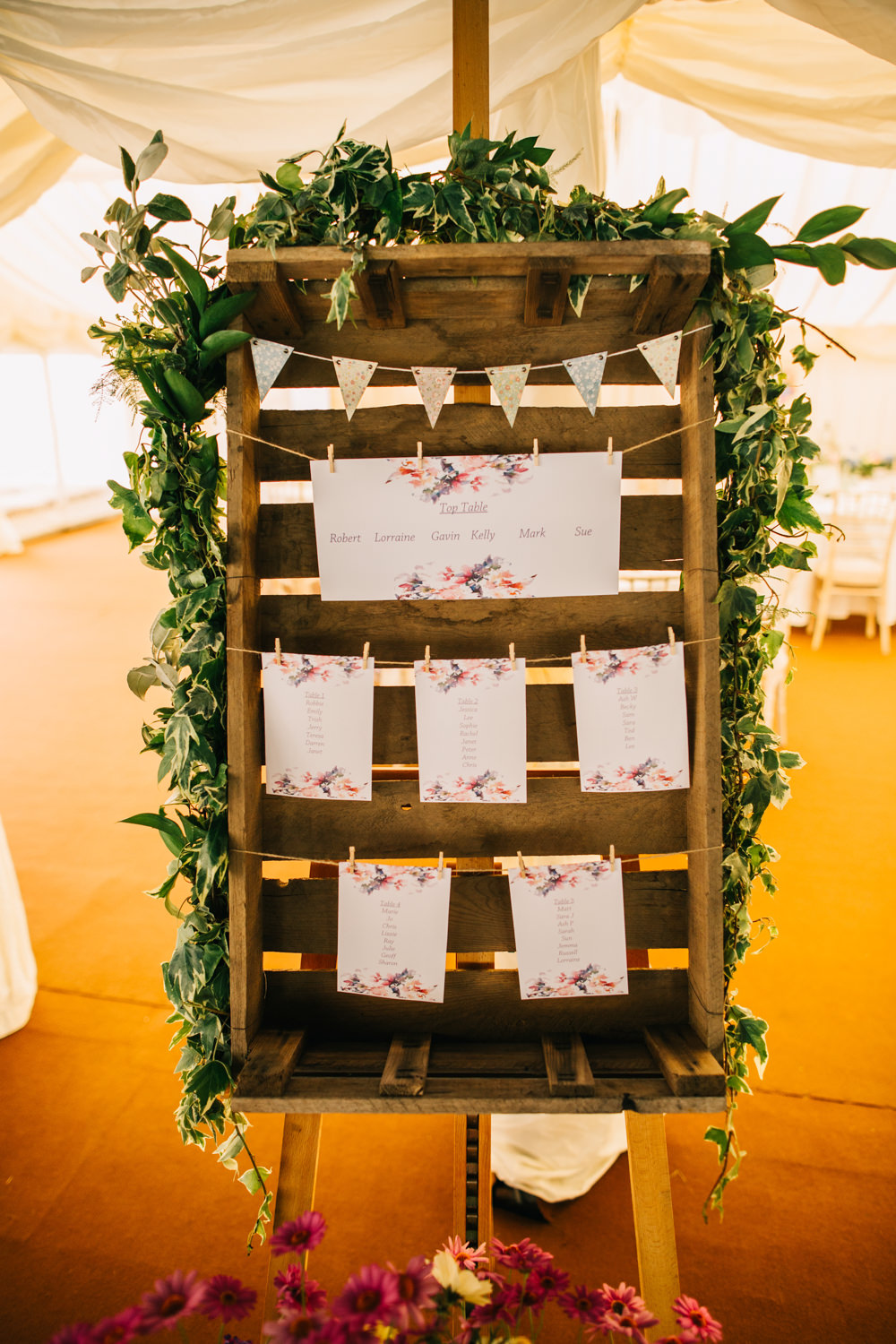wedding seating plan hanged on a wooden pallet photographed by Wedding Photographer Lincolnshire