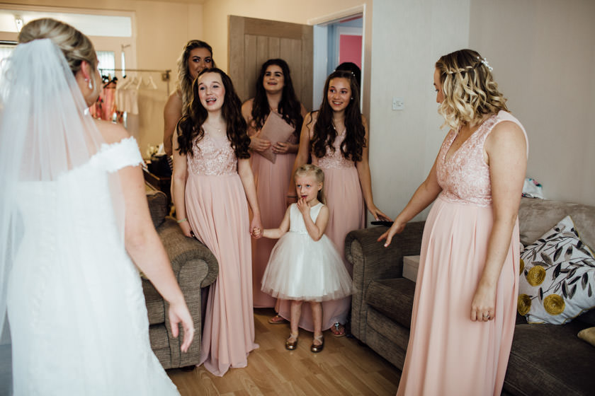 Bride in room with bridesmaids and flower girls. ready for the wedding day